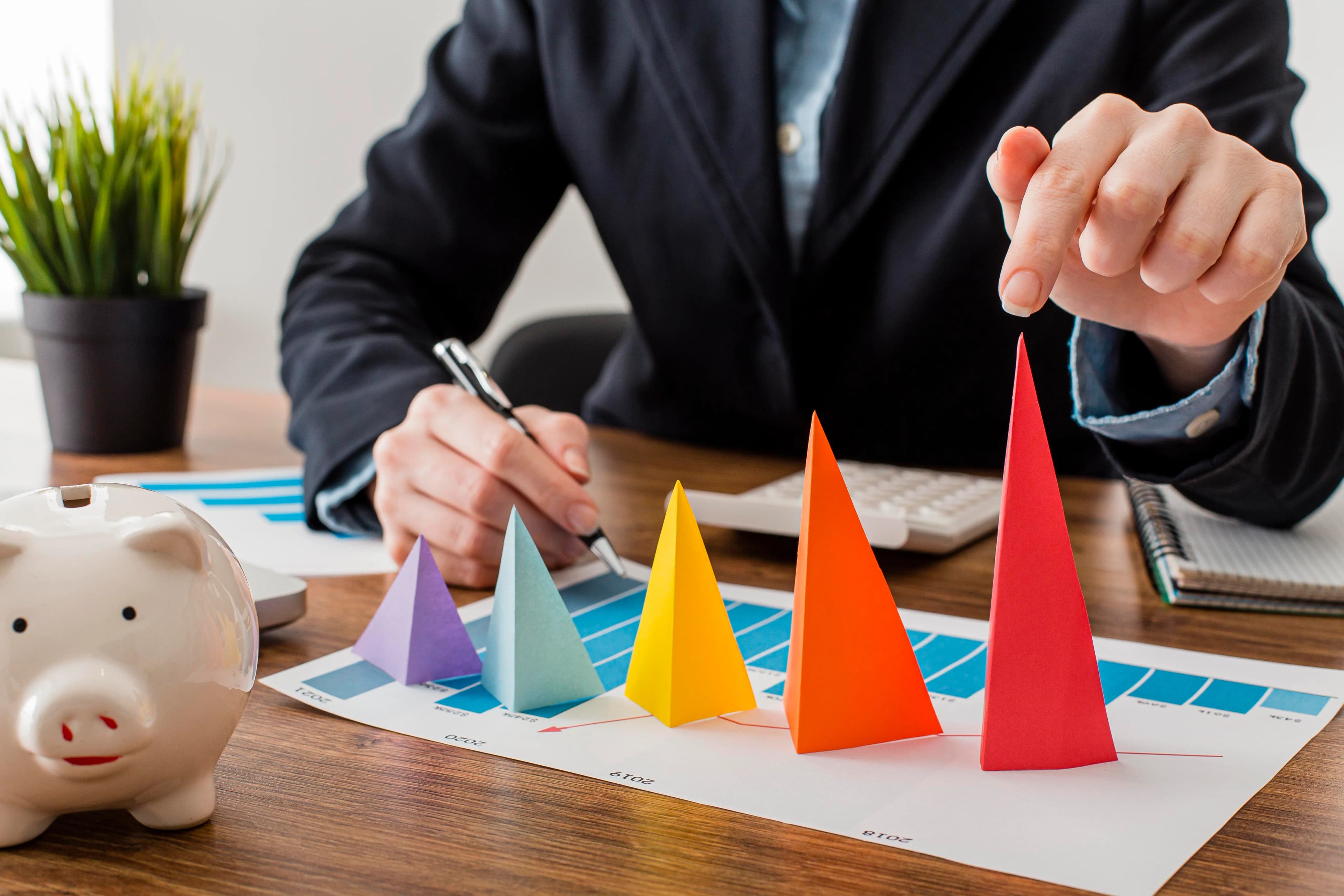 Front view businessman with colorful cones representing growth