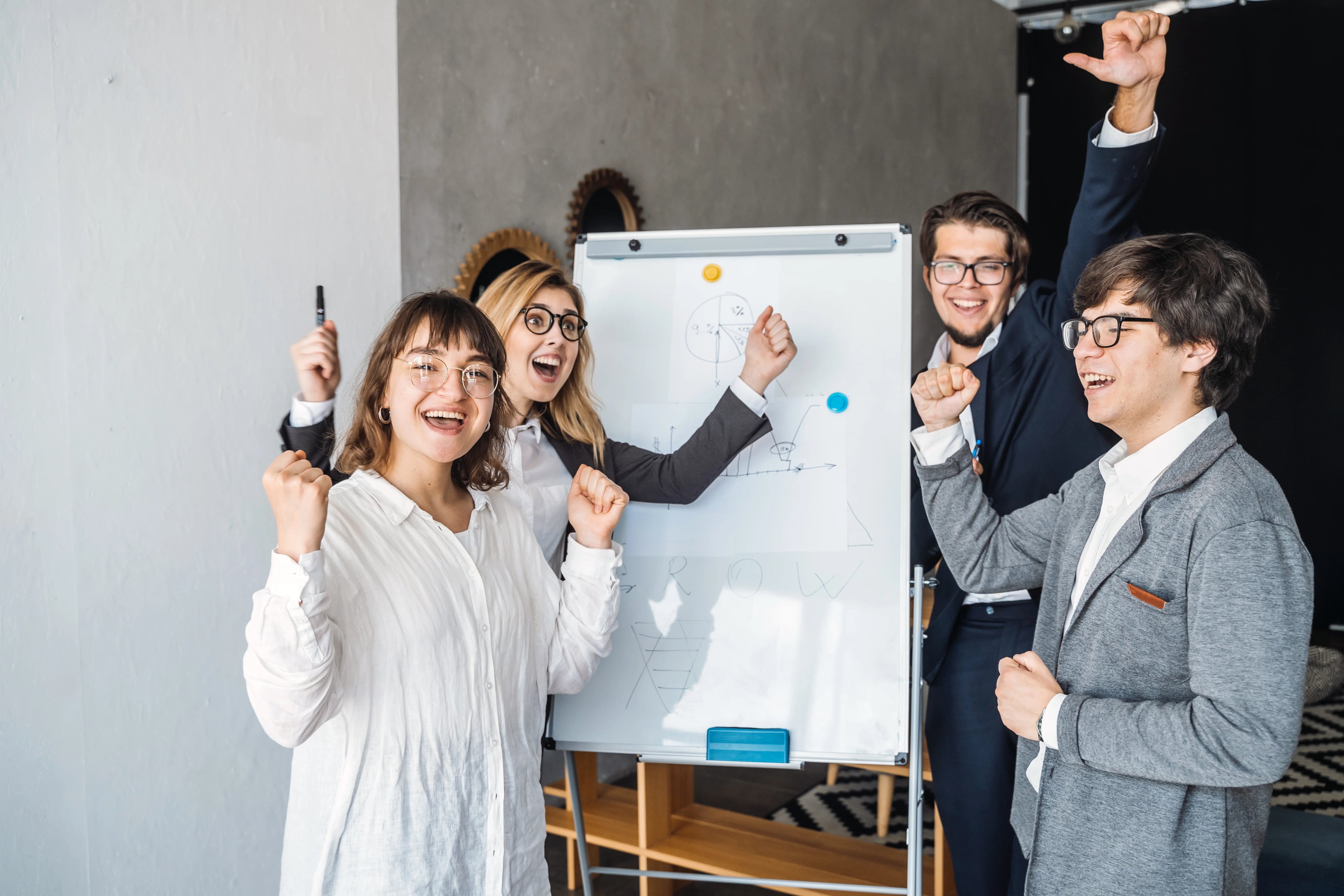 Businesspeople with whiteboard discussing strategy meeting