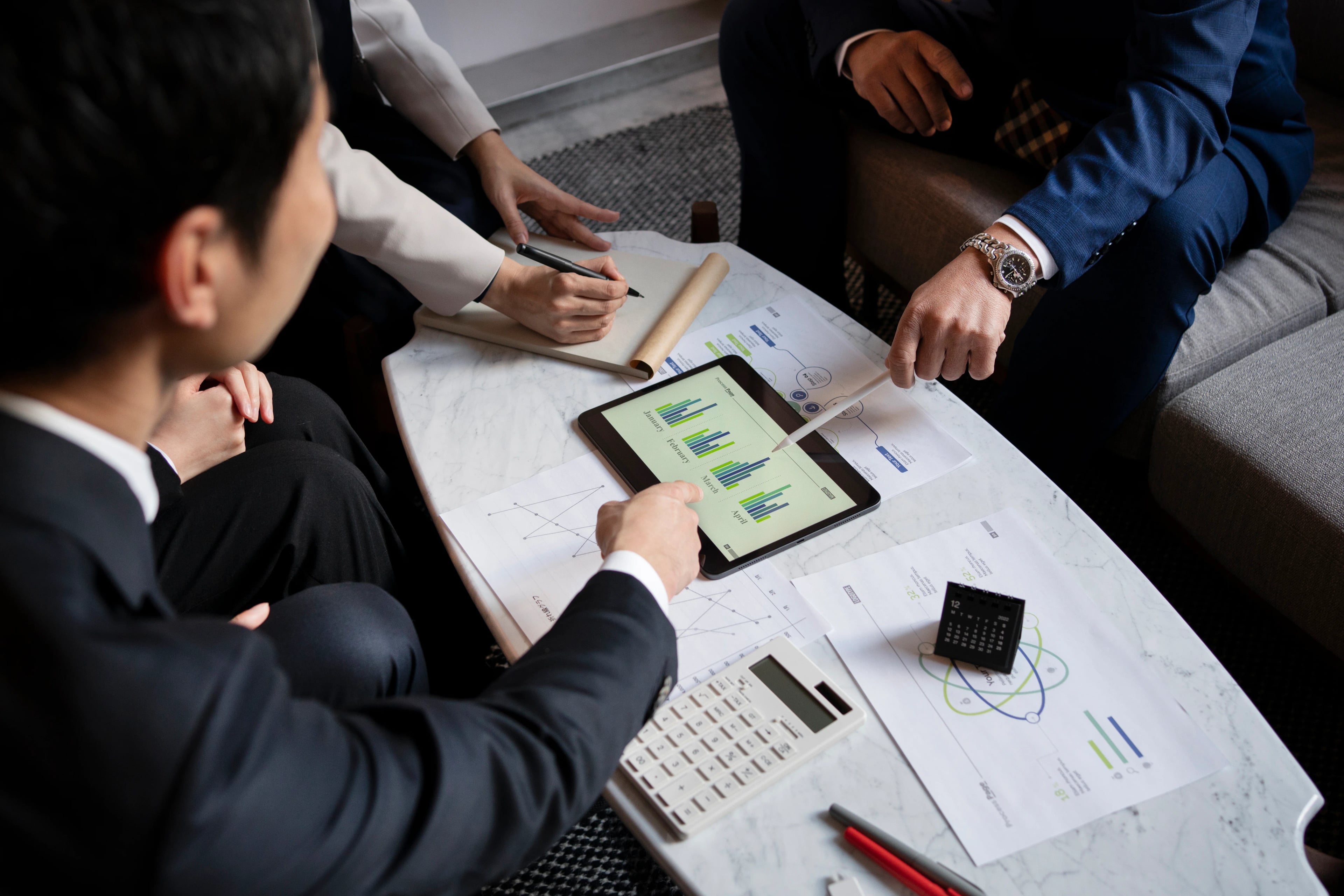 Business people working with ipad high angle