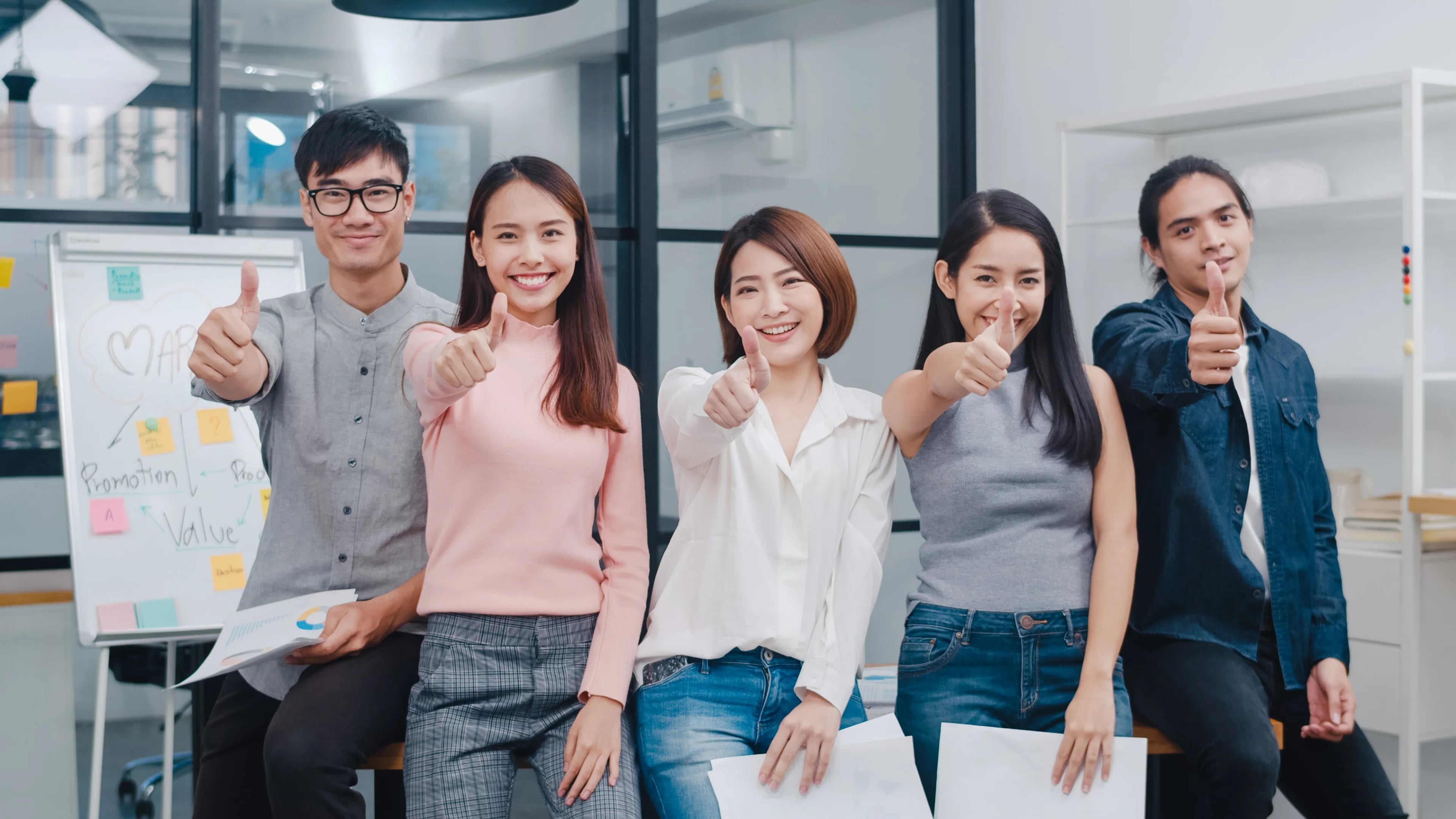 Group asia young creative people smart casual wear smiling thumbs up creative office workplace